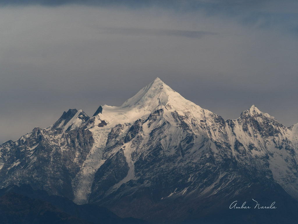 A telephoto shot of the Panchchuli 2, one of five peaks in the Panchchuli range in the Kumaon Himalayas. A clear day, with the peak bathed in the last few direct rays of a weak sun. Prints available.