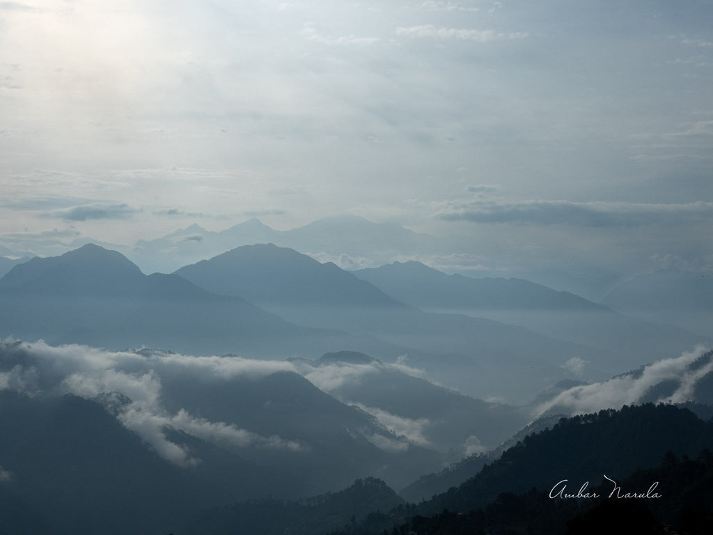A breathtaking photo of the hills leading up to the Himalayas.  Blanketed in an early morning mist, the hills are full of mystique. When printed, this photo looks more like a painting than a photo! Prints available.