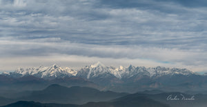 A breathtaking shot of a section of the Kumaon Himalayas. The beautiful cloud cover, the stark details of the Himalayas, contrasting against the intermediate hills make this a keeper! Prints available!