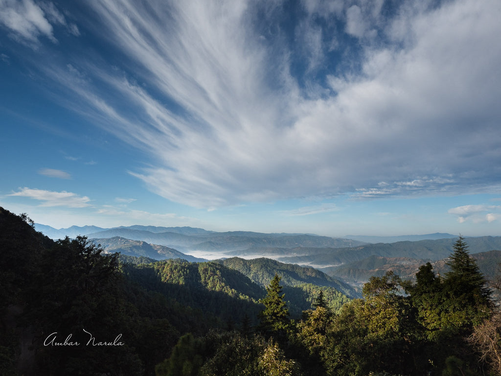 A mesmerising photo of the beginning of a beautiful day in the hills. Beautiful blue clouds racing east, mist rolling across a valley, green hills and mighty centuries-old trees. All in one frame. Want a copy? Prints available!