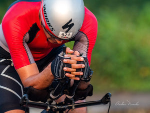 A photo of an athlete on a cycle as he prepares for an upcoming triathlon. Sweat, perseverance and human will... all on display in one moving photograph. Inspire yourself everyday, get a print here!