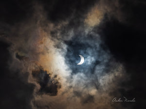 The Sun's halo casts an aura on clouds during a solar eclipse. This amazing photo shows the Third Contact stage of a solar eclipse - when the Moon is moving past the Sun after a total eclipse. Prints available.