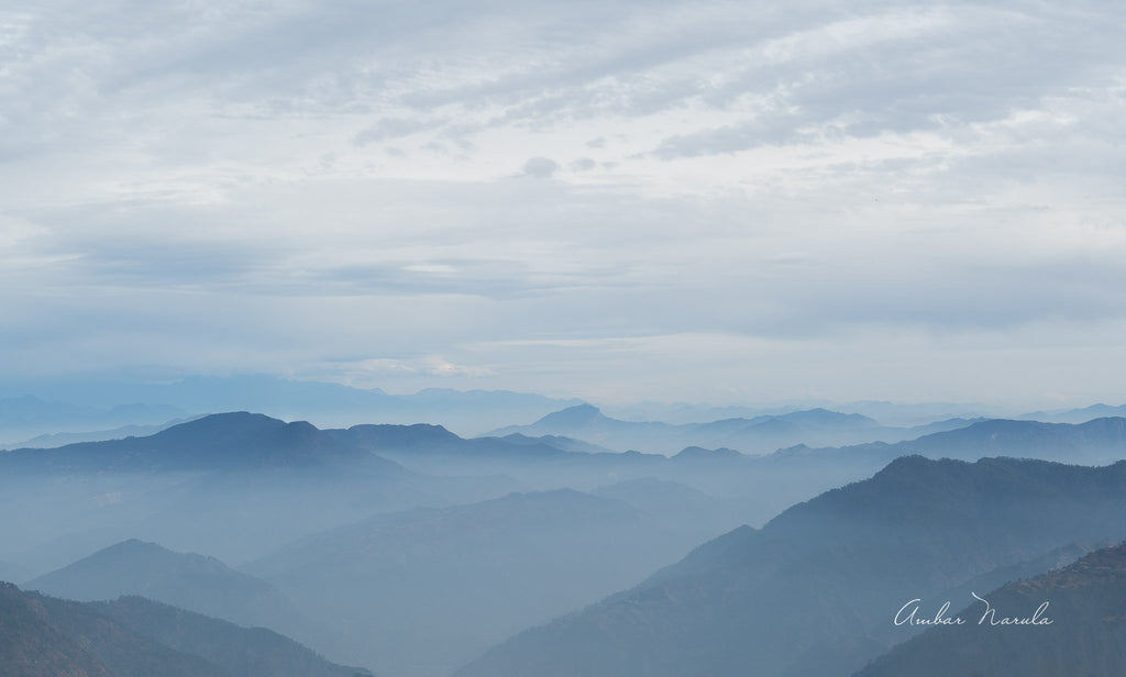 Breathtaking panoramic photo of the hills leading up to the Himalayas.  Blanketed in an early-evening mist, the hills are full of mystique. When printed, this photo looks exactly like a painting. Prints available.